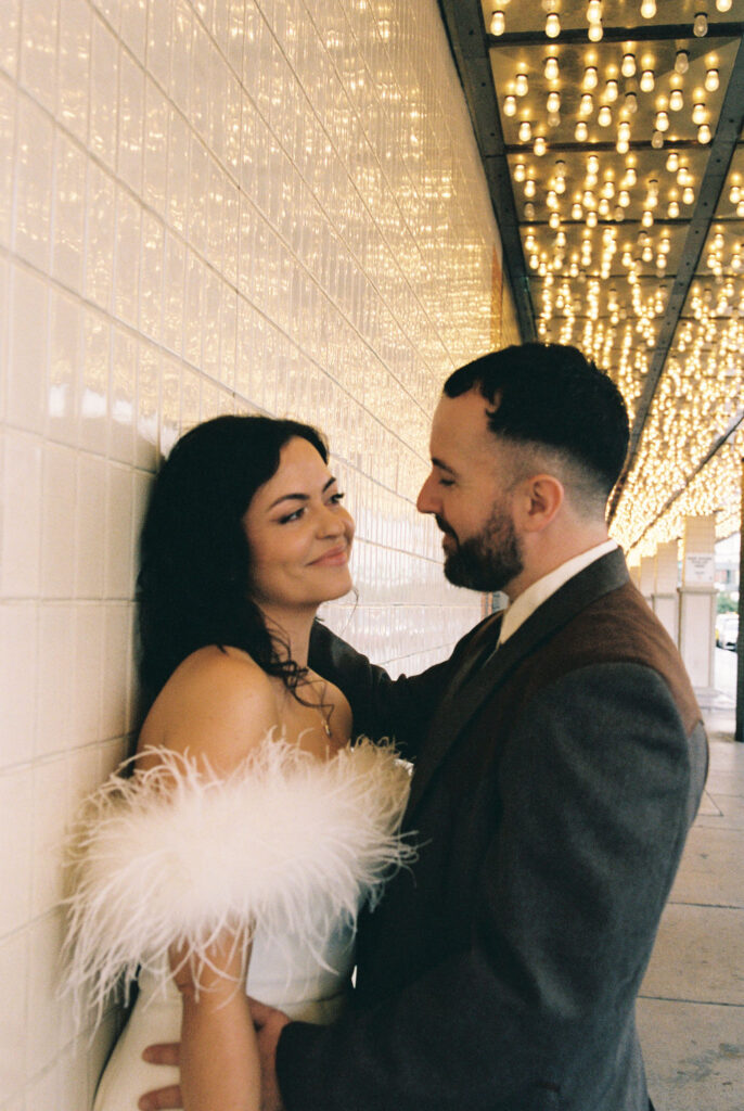 Couple celebrating their sure thing chapel elopement in Las Vegas surrounded by joyful guests.
