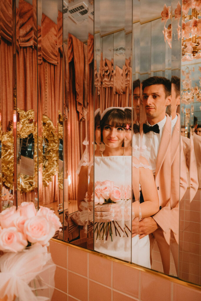 Newly married couple celebrating their Sure Thing Too elopement in downtown Las Vegas.
