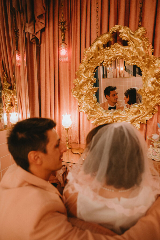 Candid elopement photos inside Sure Thing Too chapel with romantic pastel details.
