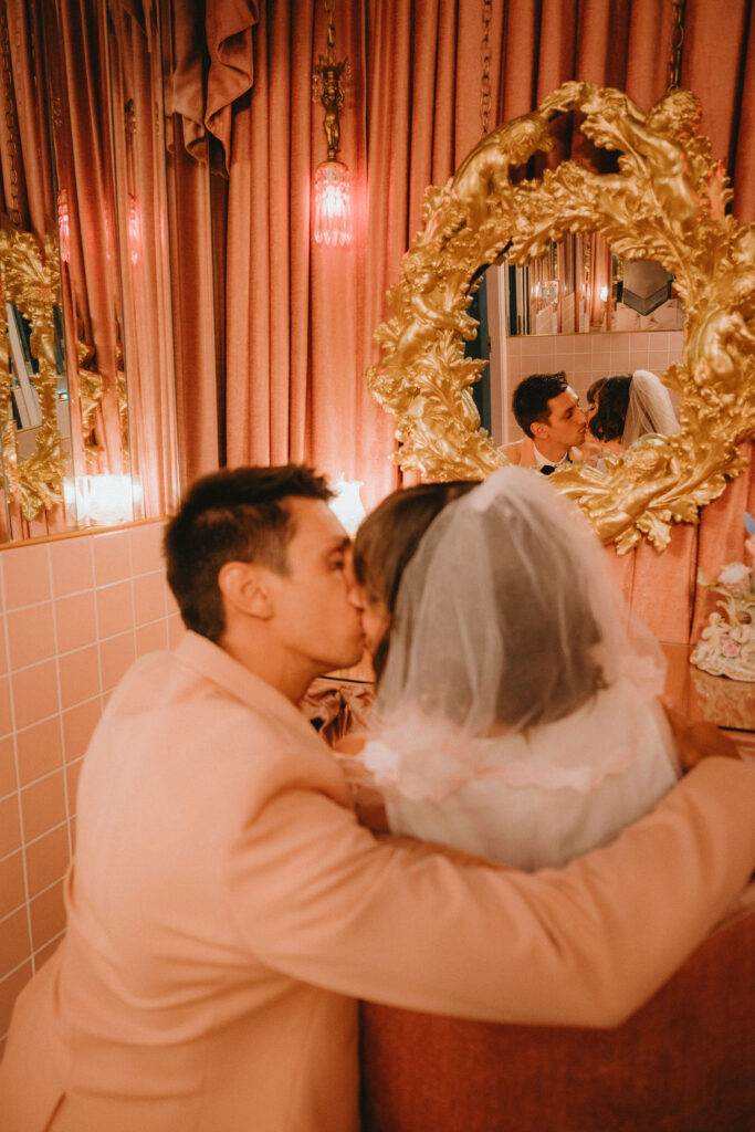 Candid elopement photos inside Sure Thing Too chapel with romantic pastel details.