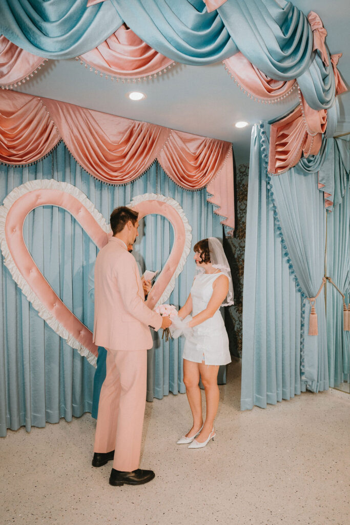 Newly married couple celebrating their Sure Thing Too elopement in downtown Las Vegas.
