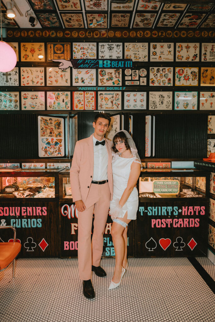 Couple marking their Las Vegas wedding with tattoos after the ceremony.
