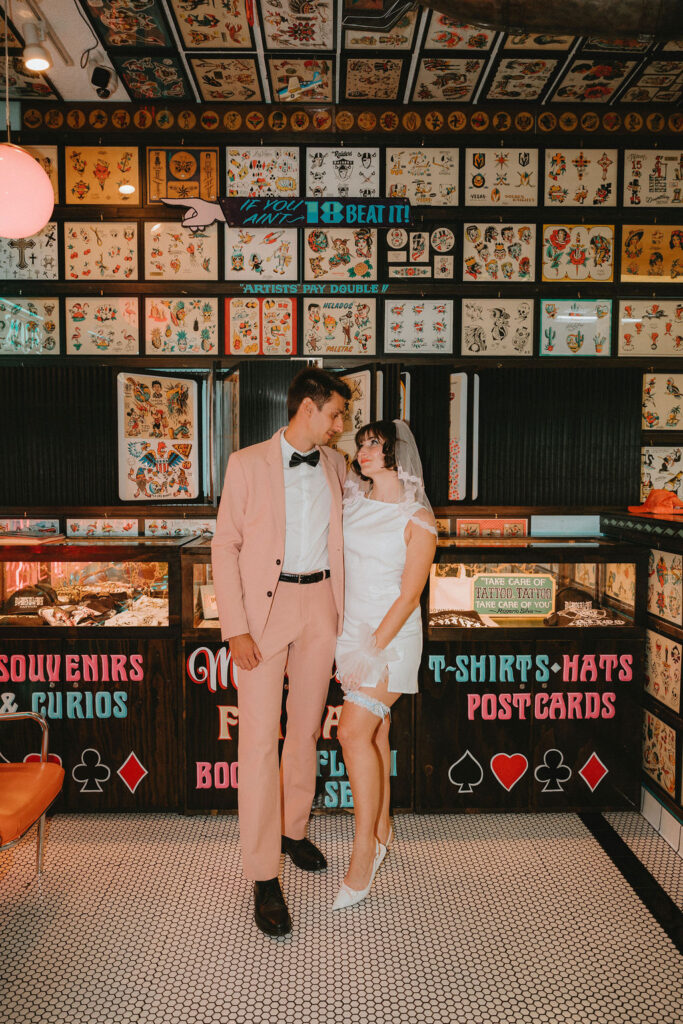 Couple marking their Las Vegas wedding with tattoos after the ceremony.
