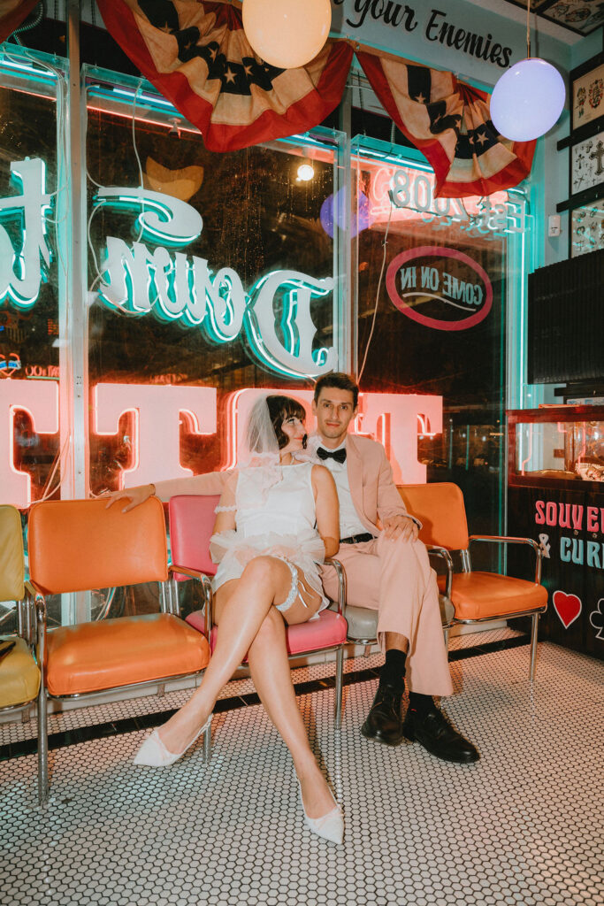 Couple marking their Las Vegas wedding with tattoos after the ceremony.
