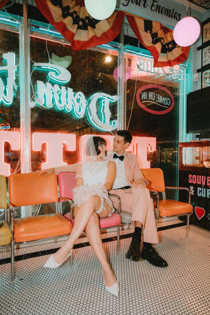 Couple marking their Las Vegas wedding with tattoos after the ceremony.
