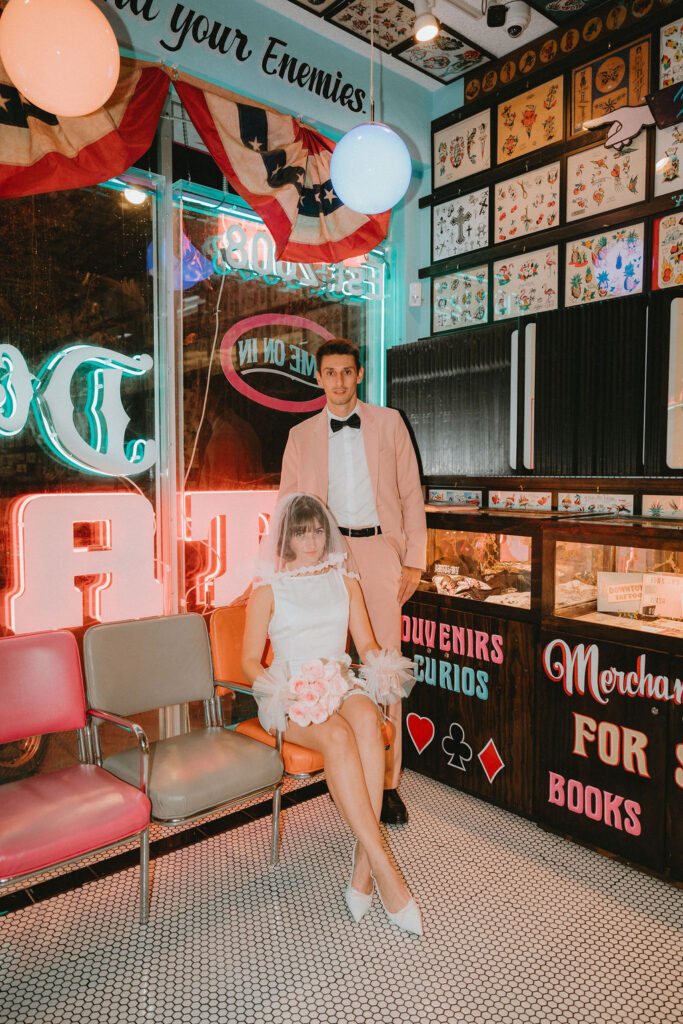 Couple marking their Las Vegas wedding with tattoos after the ceremony.