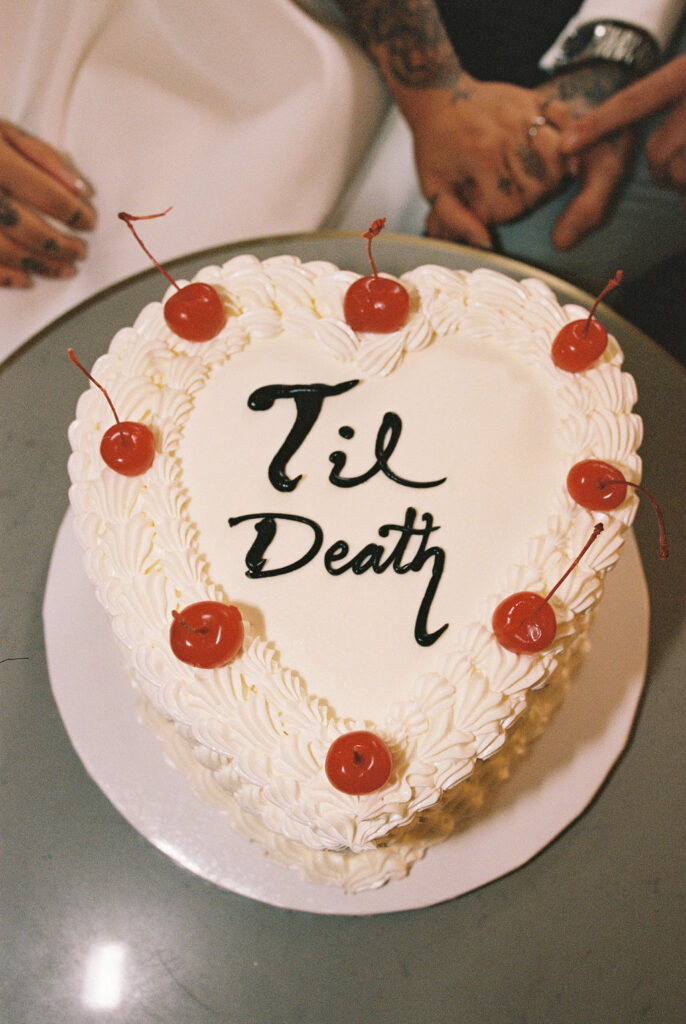 Candid moment of the couple celebrating their downtown Las Vegas wedding with playful energy.
