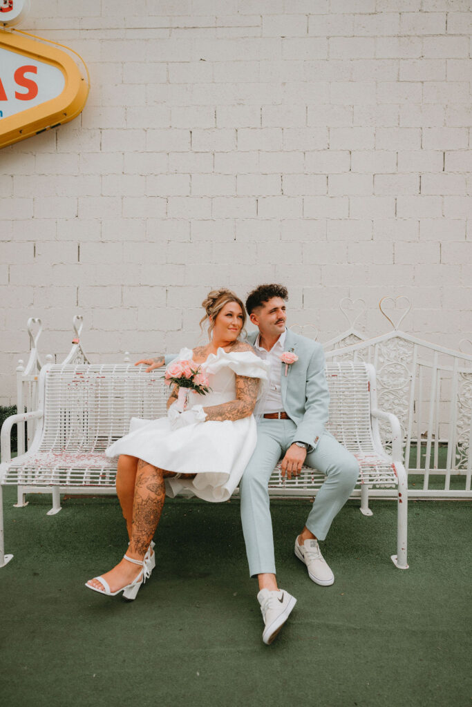 Candid moment of the couple celebrating their downtown Las Vegas wedding with playful energy.

