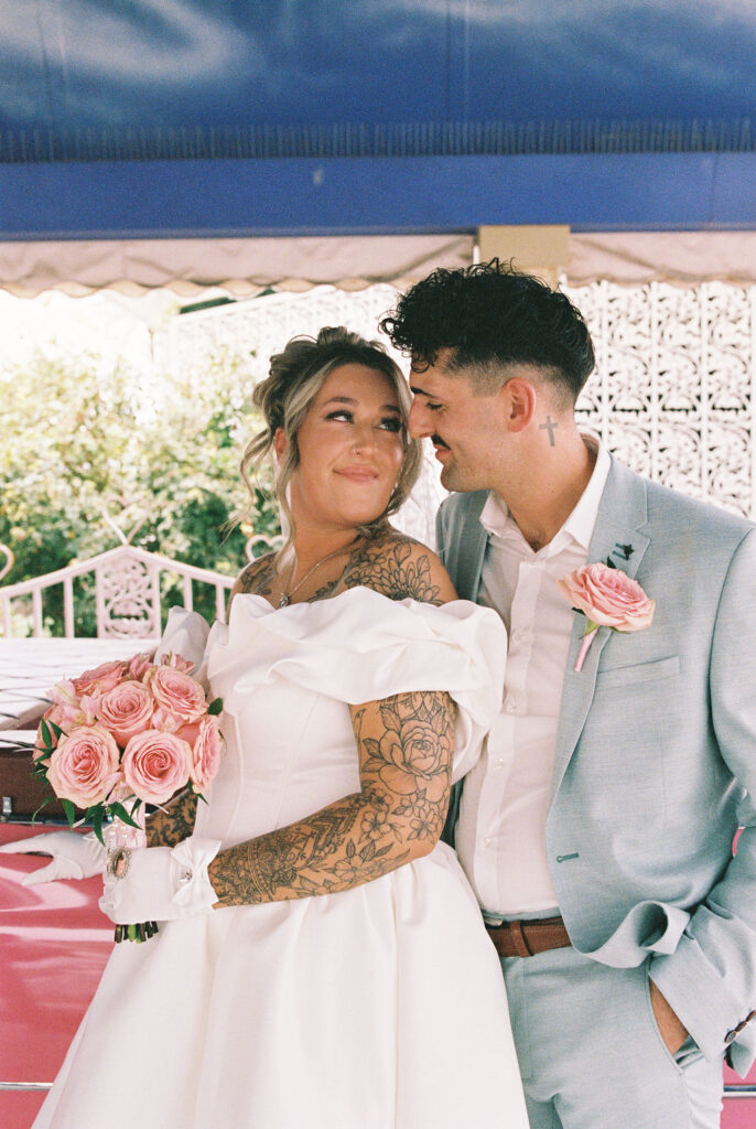 Newlyweds enjoying iconic downtown Las Vegas locations during their wedding celebration.