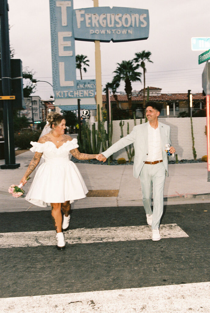 Newlyweds enjoying iconic downtown Las Vegas locations during their wedding celebration.
