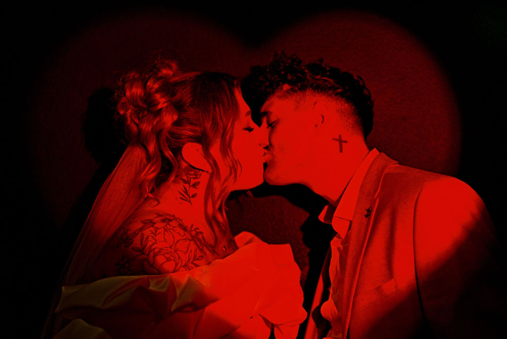 Couple exploring downtown Las Vegas during their wedding day with a fun and candid vibe.
