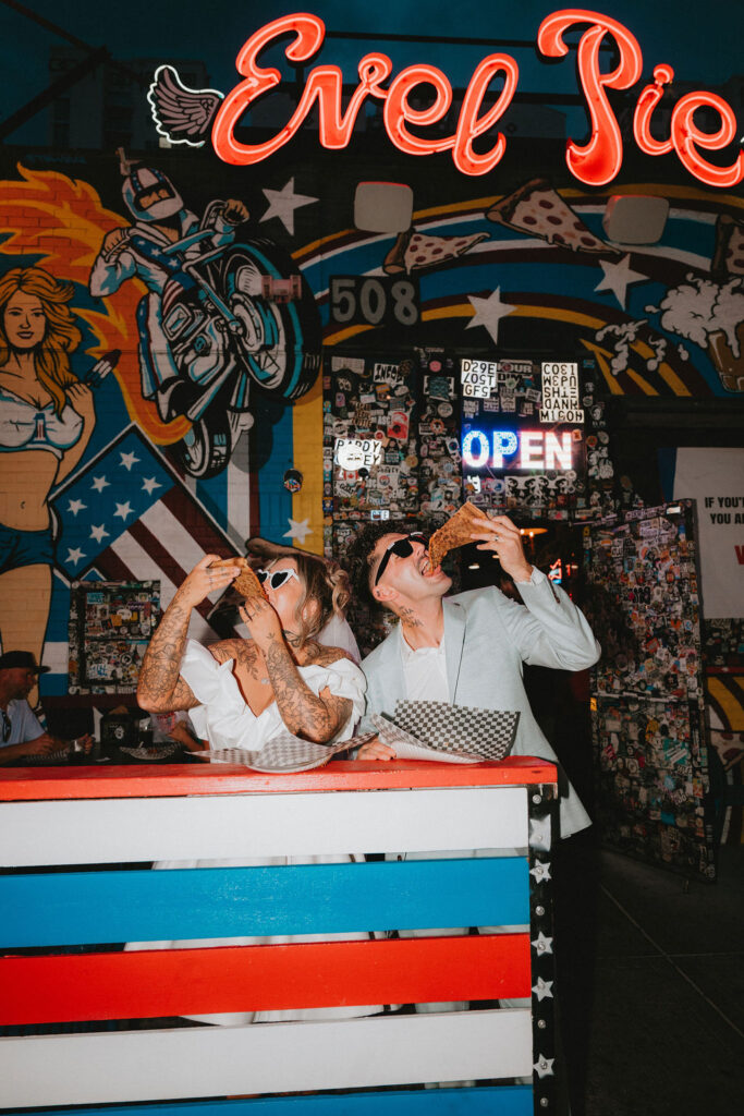 Couple exploring downtown Las Vegas during their wedding day with a fun and candid vibe.
