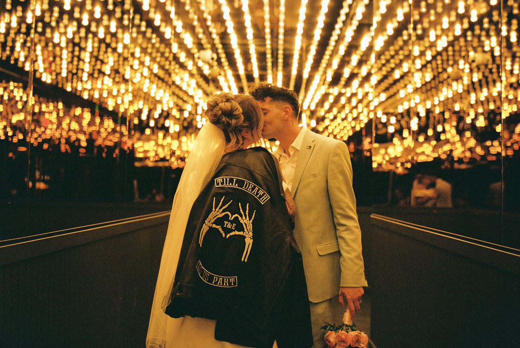 Couple exploring downtown Las Vegas during their wedding day with a fun and candid vibe.
