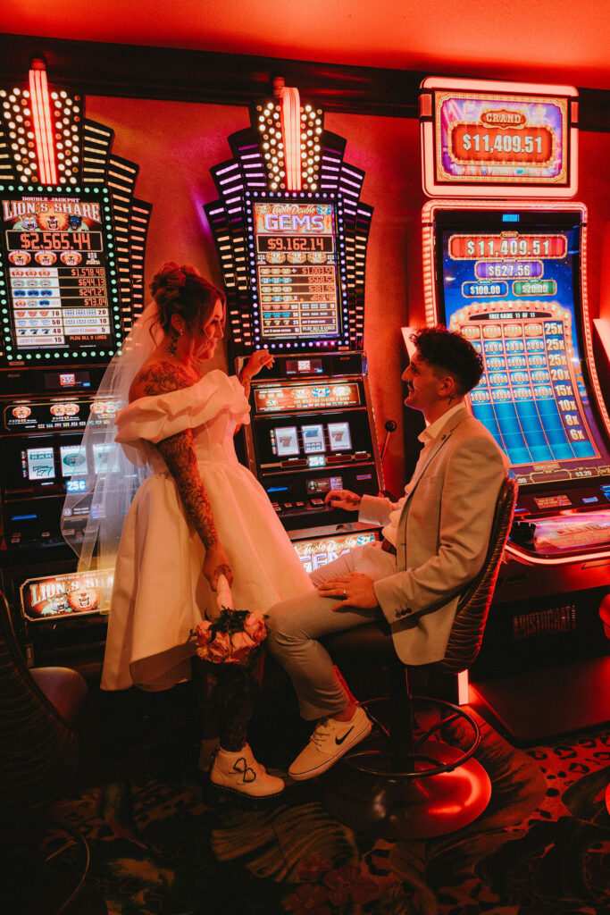 Couple exploring downtown Las Vegas during their wedding day with a fun and candid vibe.
