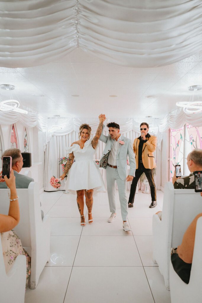 Newlyweds enjoying iconic downtown Las Vegas locations during their wedding celebration.
