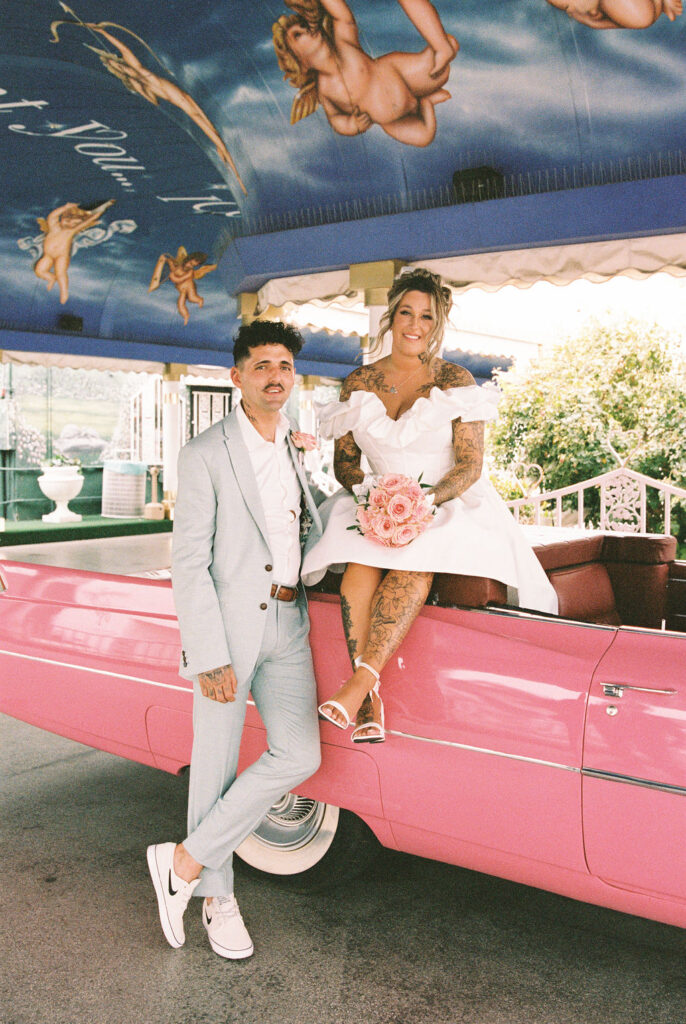 Couple exploring downtown Las Vegas during their wedding day with a fun and candid vibe.
