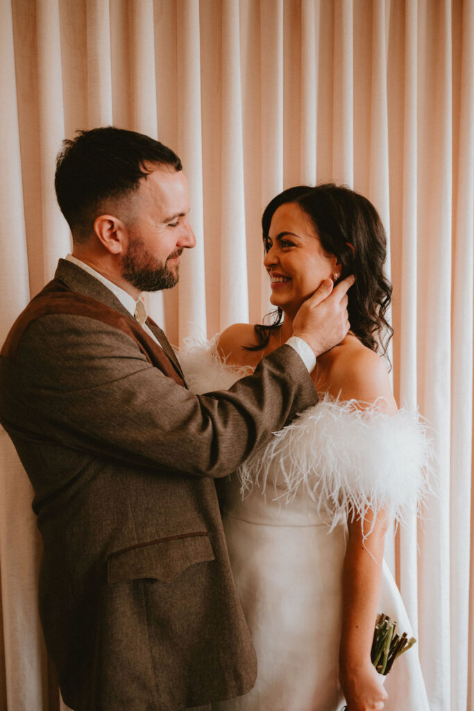 Couple celebrating their sure thing chapel elopement in Las Vegas surrounded by joyful guests.
