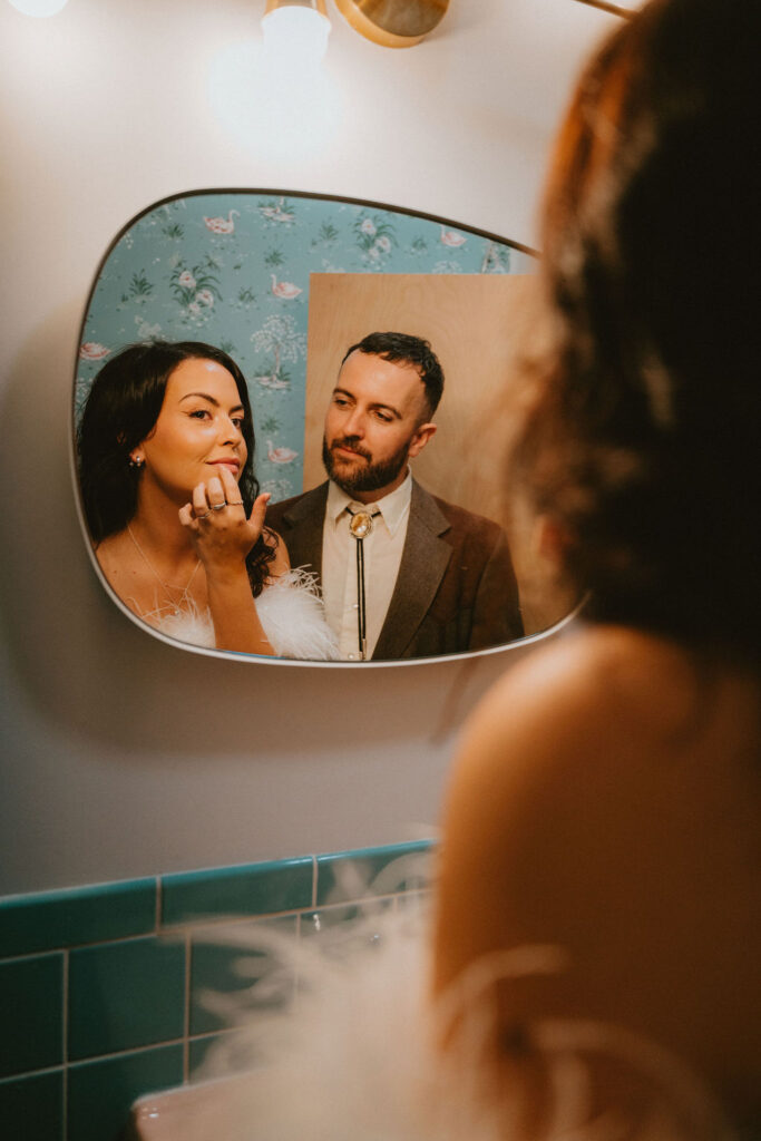 Couple celebrating their sure thing chapel elopement in Las Vegas surrounded by joyful guests.
