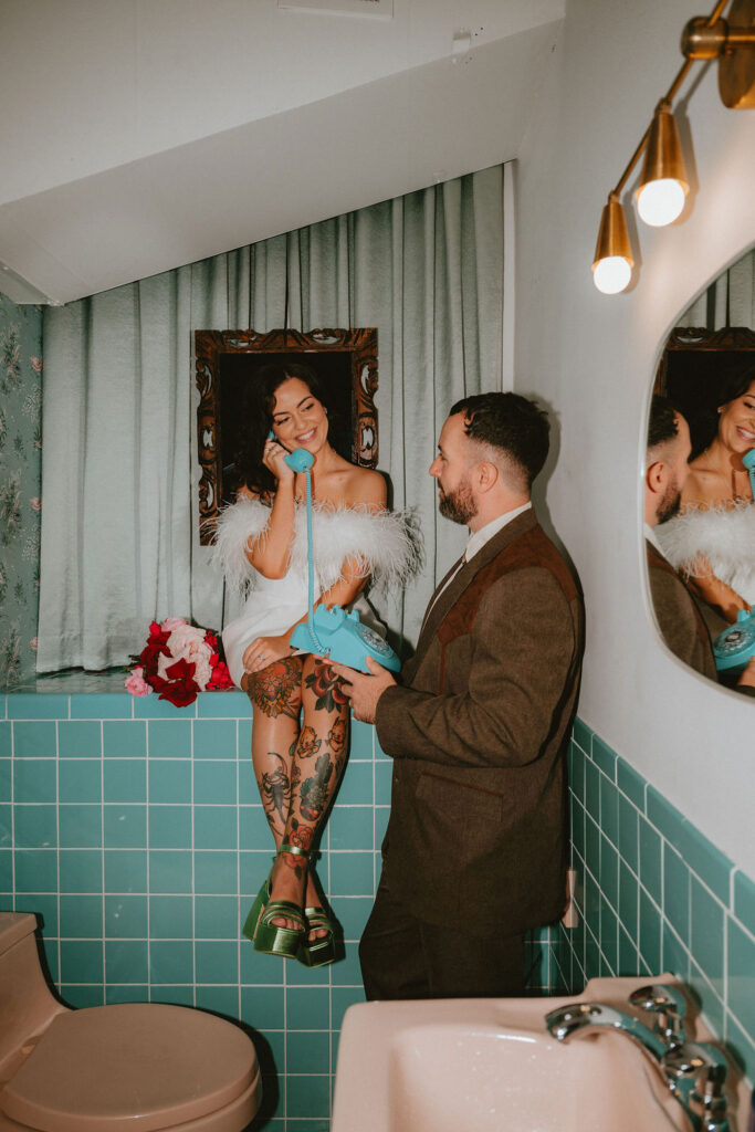 Couple celebrating their sure thing chapel elopement in Las Vegas surrounded by joyful guests.
