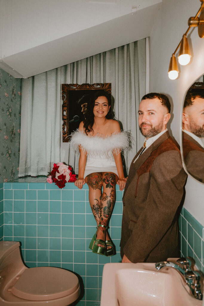 Couple celebrating their sure thing chapel elopement in Las Vegas surrounded by joyful guests.
