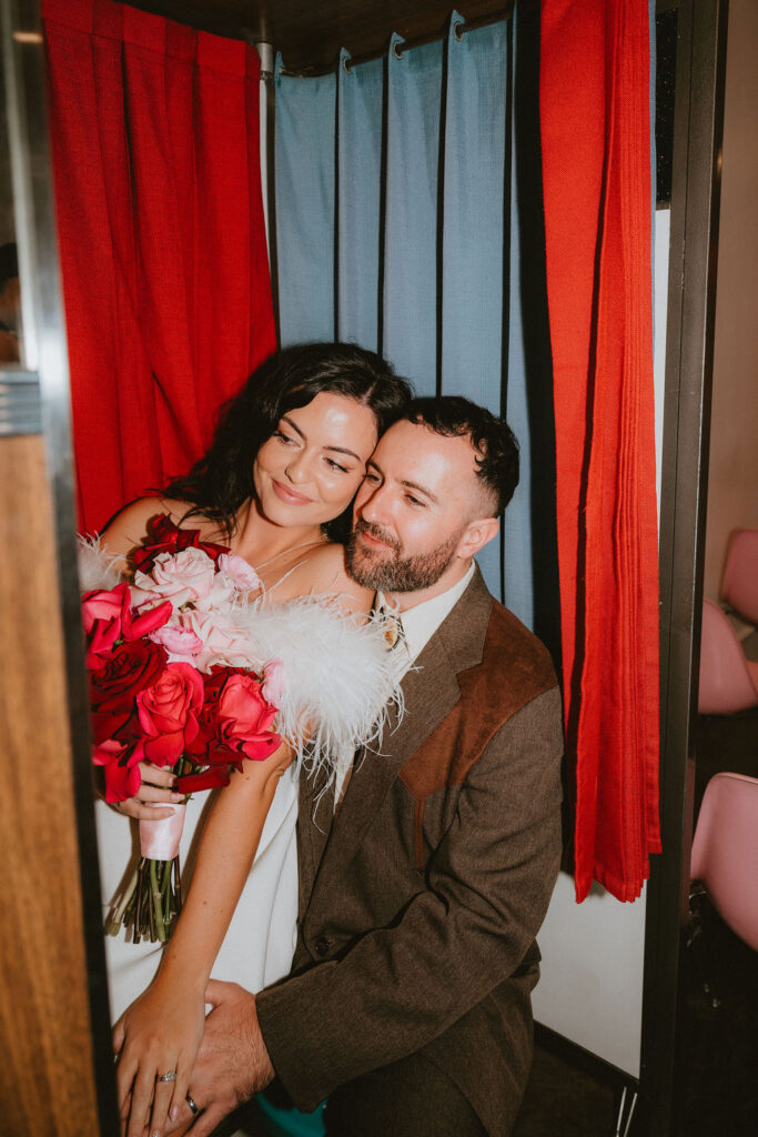 Couple celebrating their sure thing chapel elopement in Las Vegas surrounded by joyful guests.

