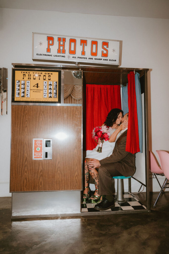 Couple celebrating their sure thing chapel elopement in Las Vegas surrounded by joyful guests.
