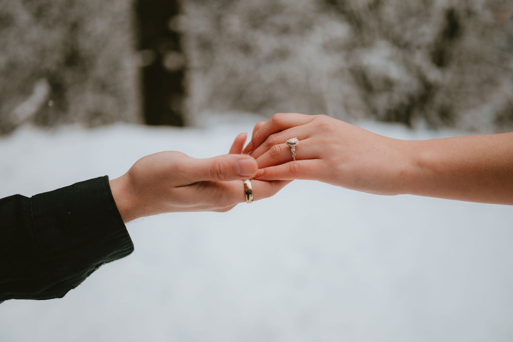 Couple walking along the Oregon Coast during a moody engagement session.