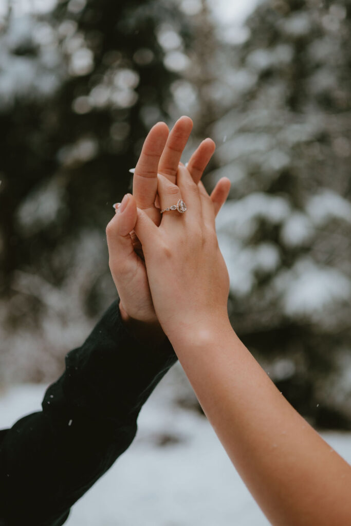 Adventurous Oregon Coast engagement session with the couple embracing the elements.
