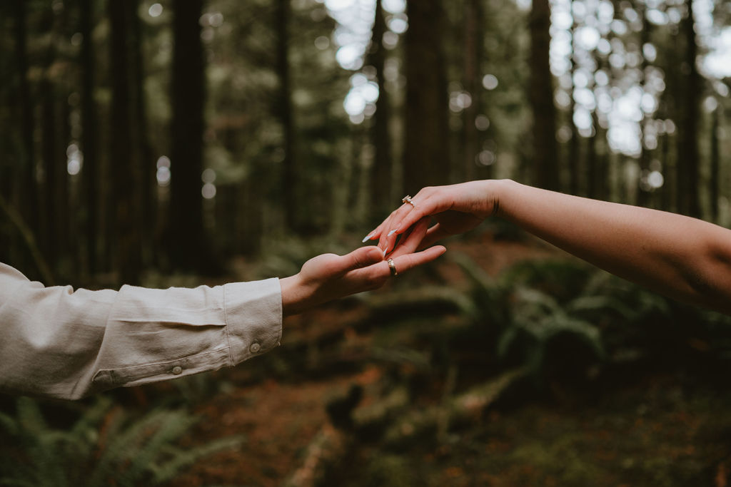 Adventurous Oregon Coast engagement session with the couple embracing the elements.