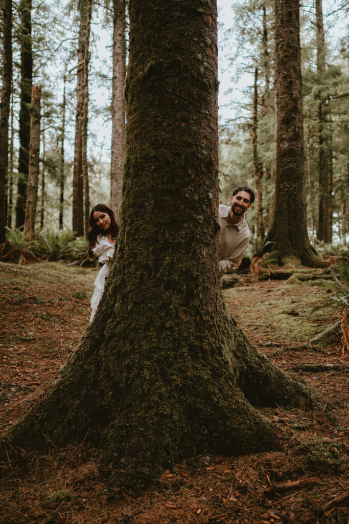 Couple walking along the Oregon Coast during a moody engagement session.