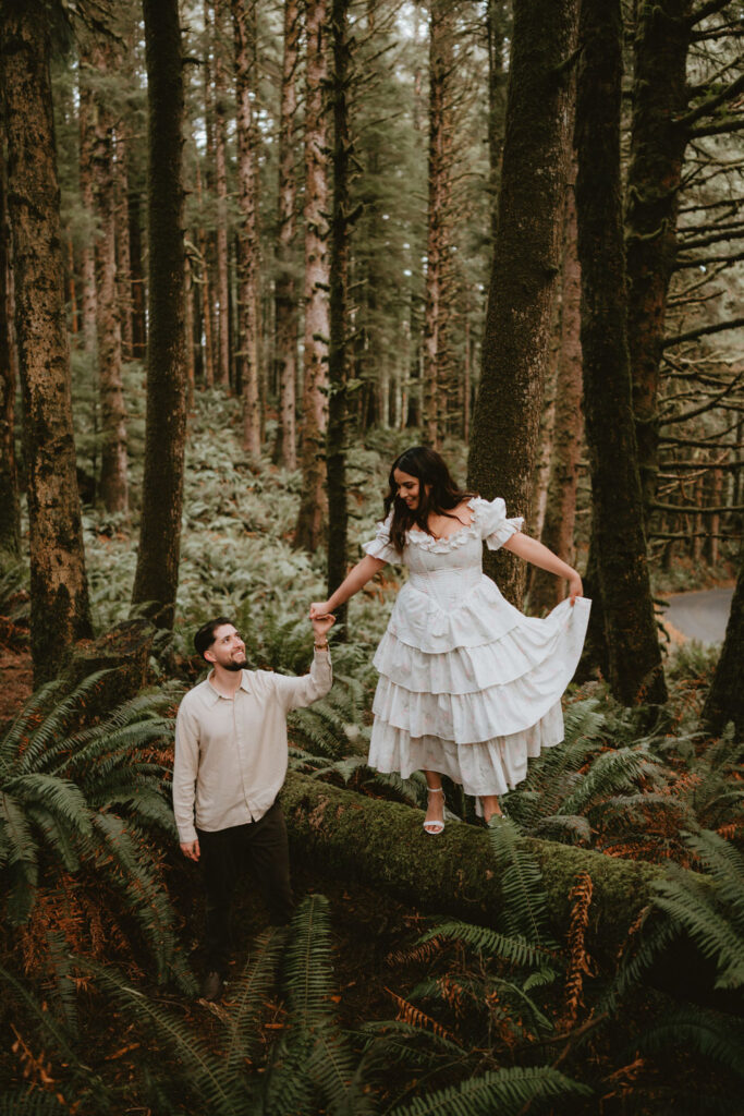 Couple walking along the Oregon Coast during a moody engagement session.