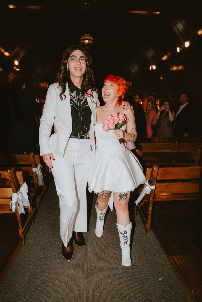 Candid photo of the couple holding hands after their ceremony at Little Church of the West.
