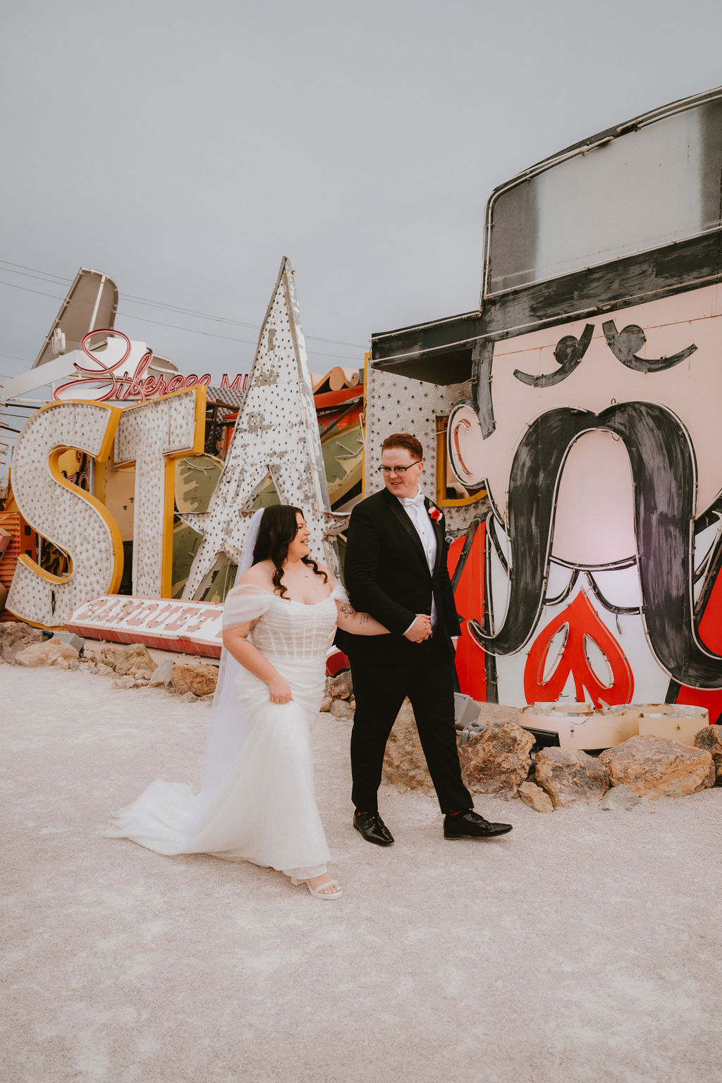 Bride and groom exit their Neon Museum wedding