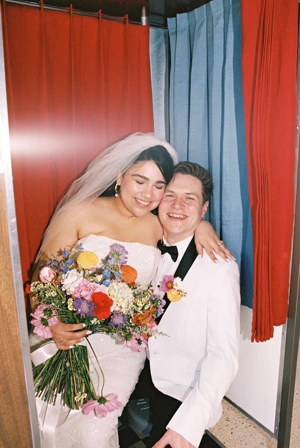 Couple in a Photo Booth at their playful Las Vegas elopement