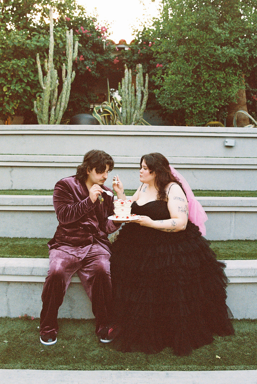 Bride and groom smoking a joint at their 420 friendly Las Vegas elopement