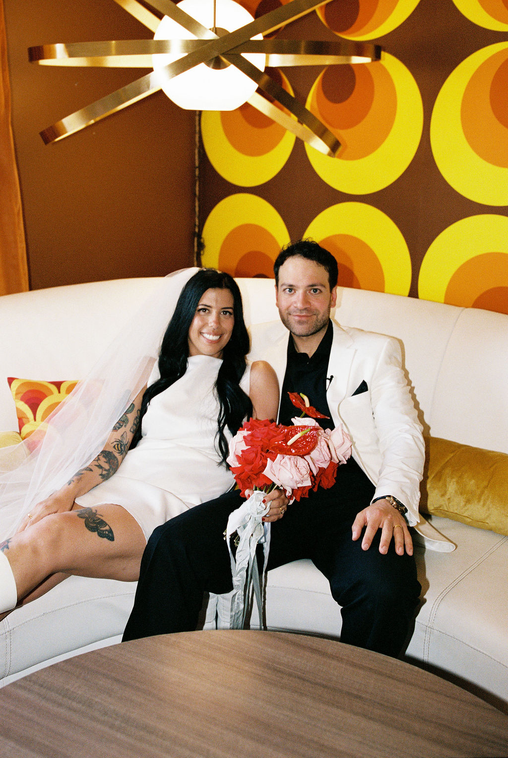 Couple on the couch at their Lacy Lane Las Vegas wedding reception