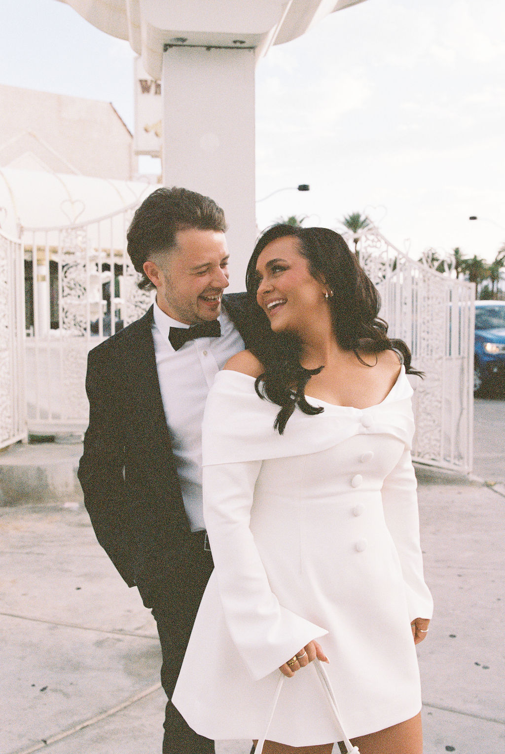 Bride and groom laugh at Tunnel of Love wedding