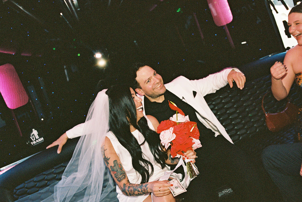 Bride and groom on bus to Lacy Lane Las Vegas wedding reception
