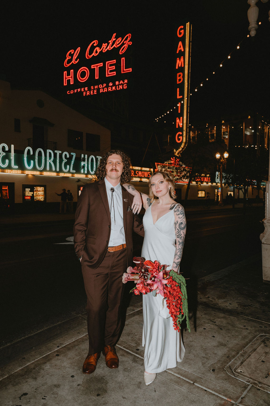 Bride and groom in Las Vegas with neon lights