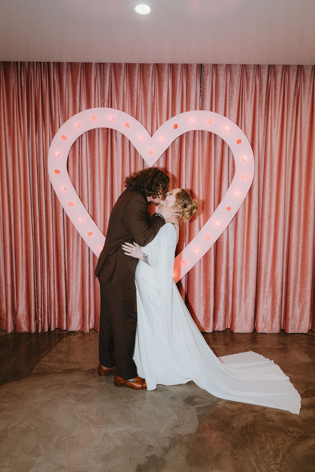 Bride and groom kiss at their Sure Thing Chapel wedding