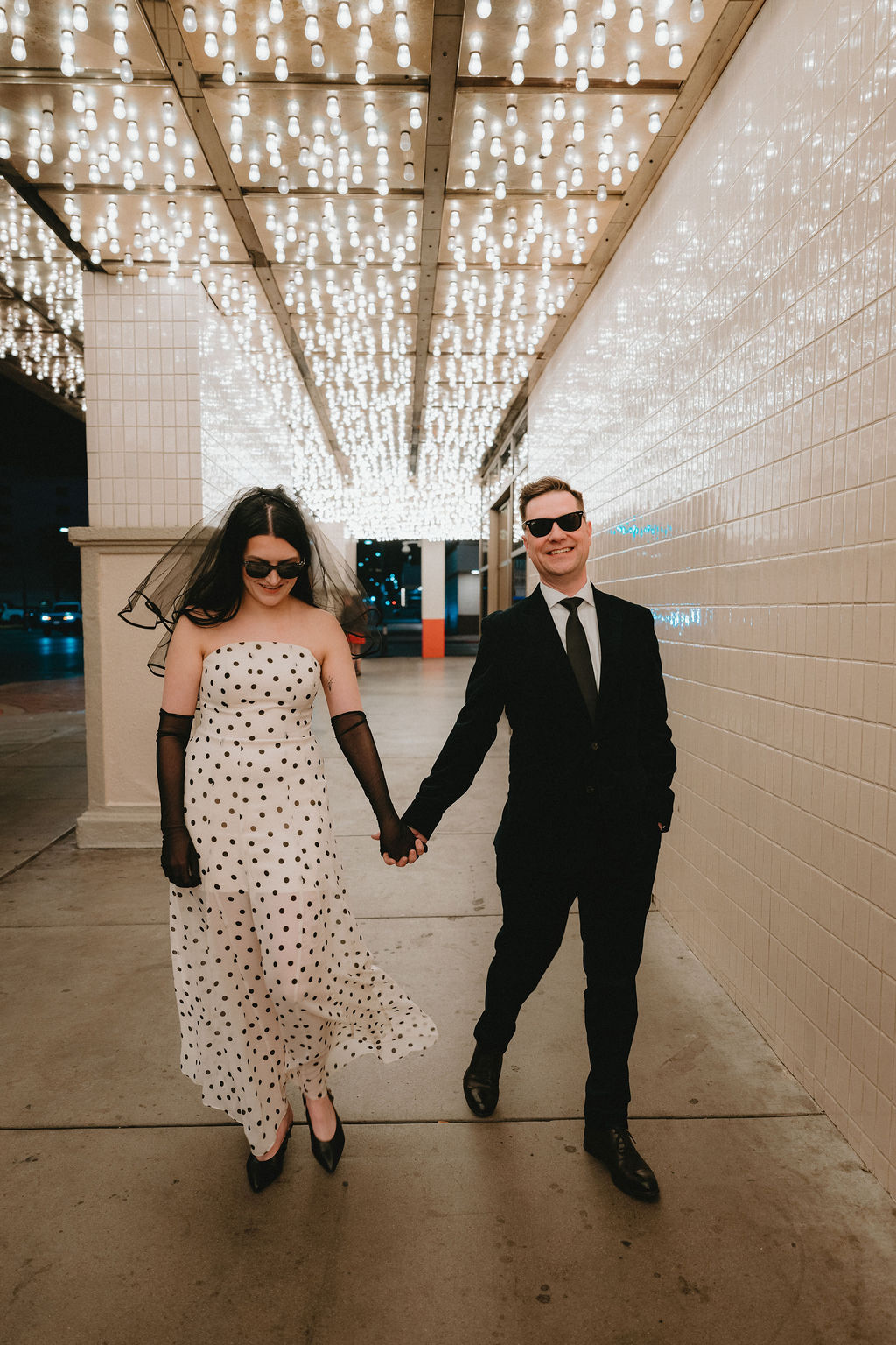 Couple holds hands at their Las Vegas wedding photos before the ceremony