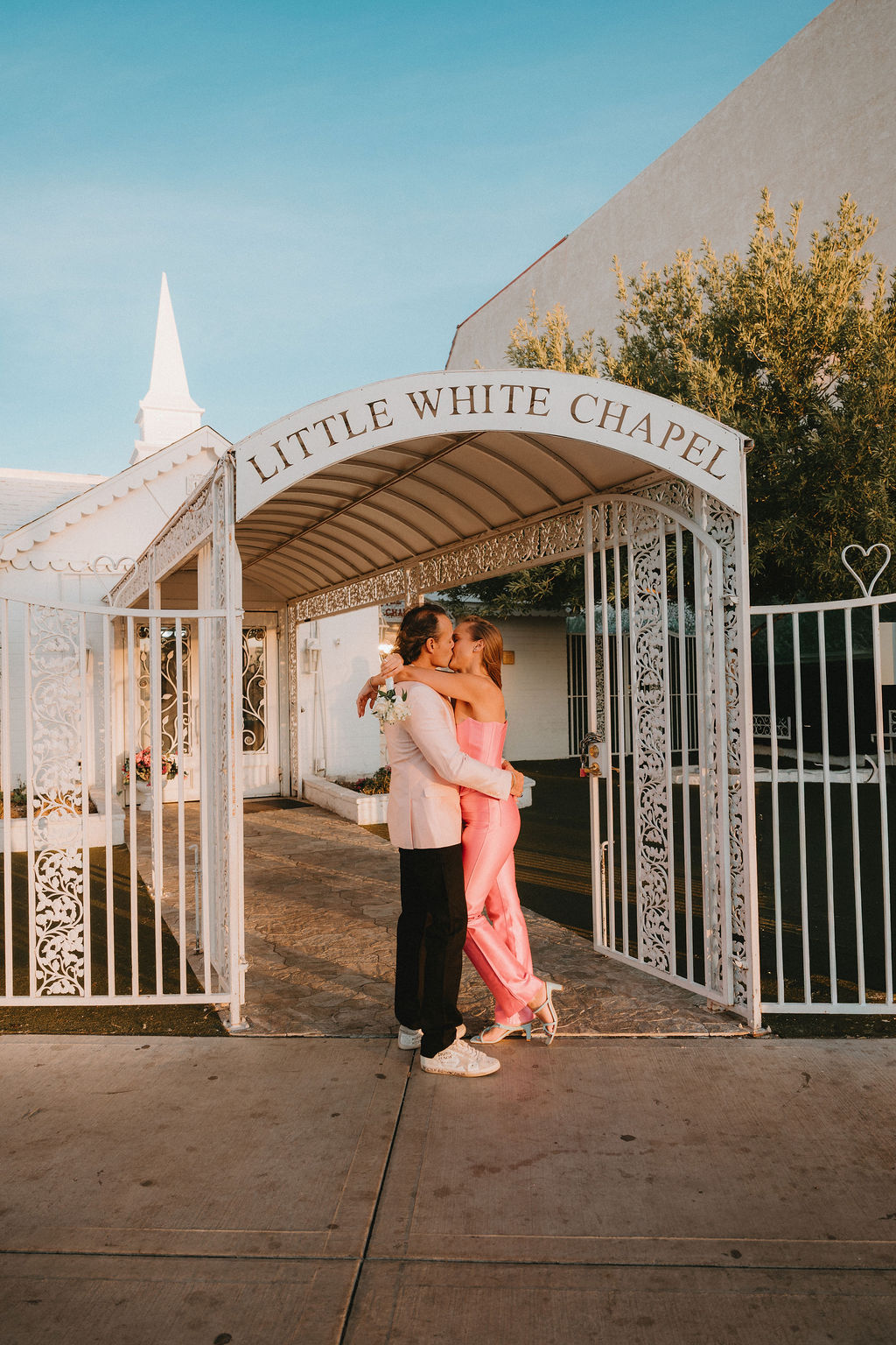 Couple kisses at their Las Vegas vow renewal at Little White Chapel