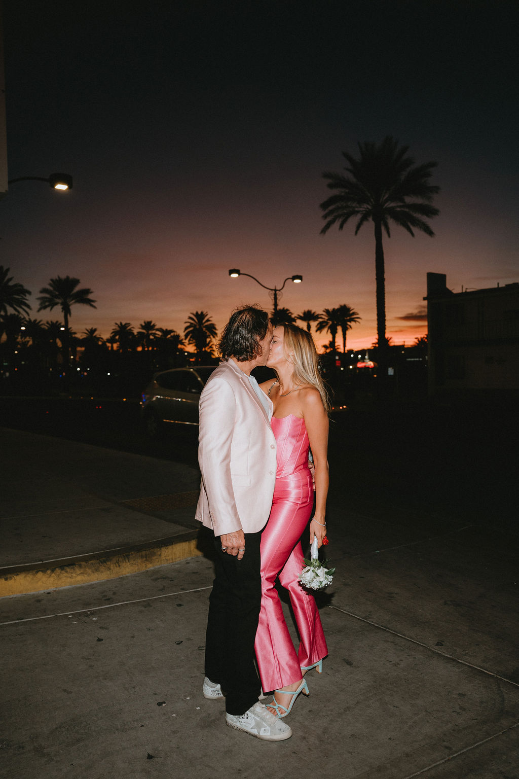 Couple kisses at sunset at their Las Vegas vow renewal