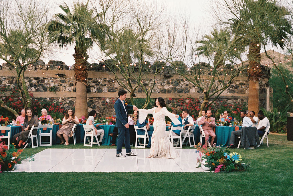 Bride and groom have first dance at their Oasis at Death Valley wedding reception
