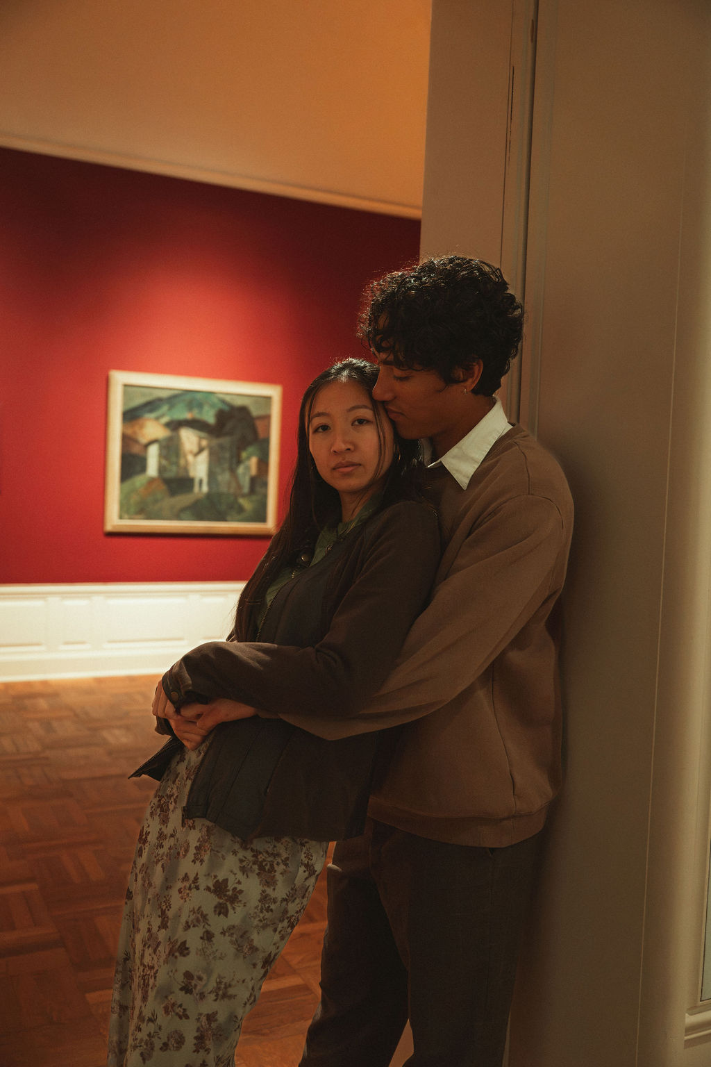 Couple embraces at their Portland Art Museum engagement photos