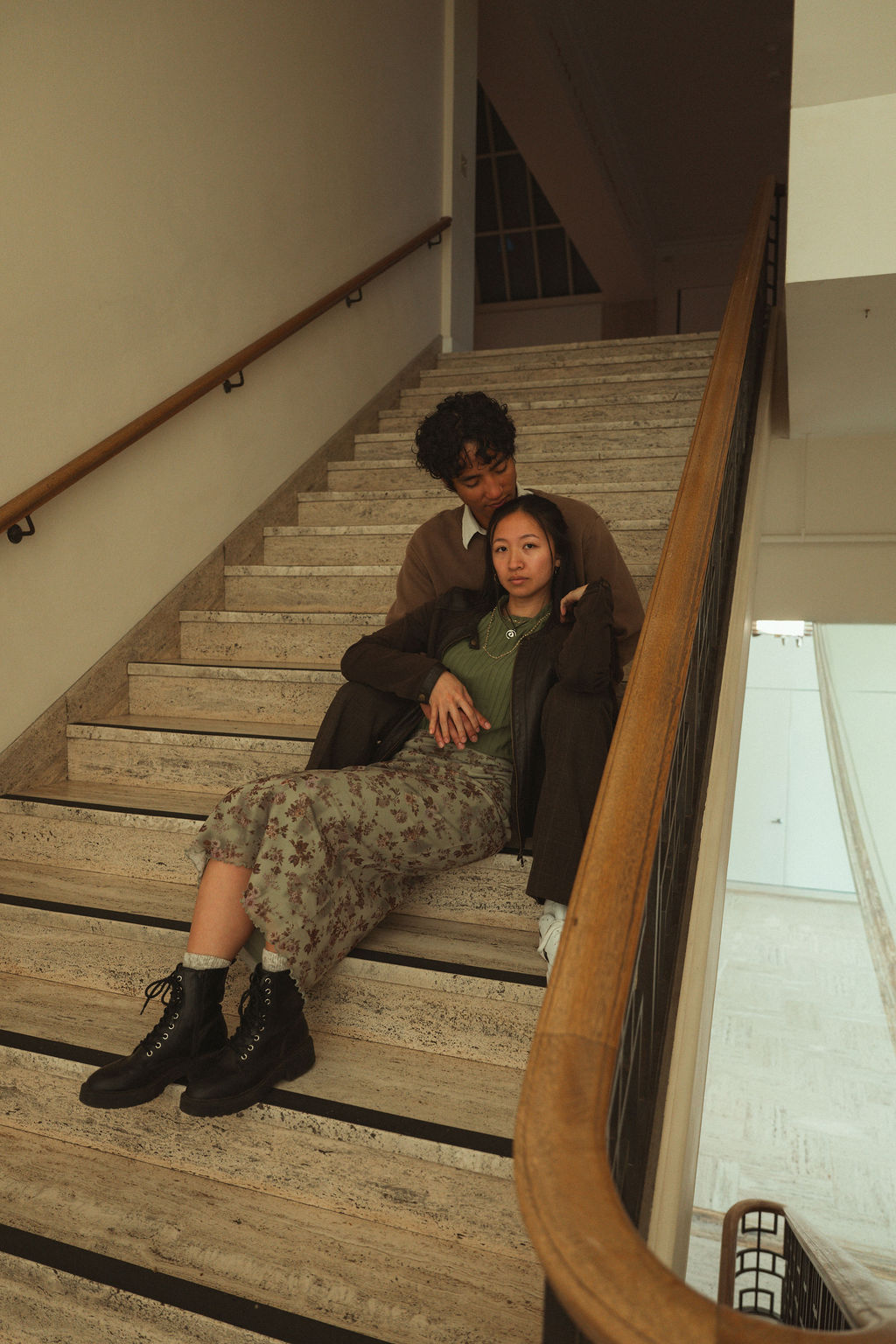 Couple on the stairs at their Portland Art Museum engagement photos